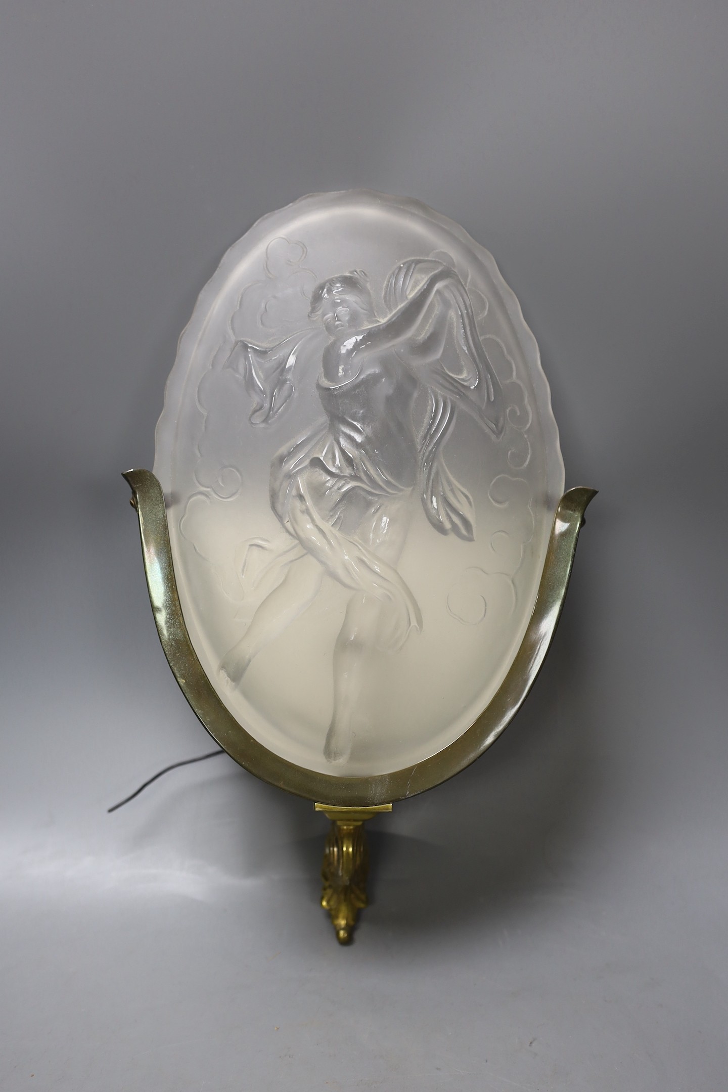 Four frosted glass wall lights with figural reliefs